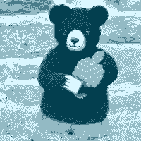 A plushy bear holding a raspberry